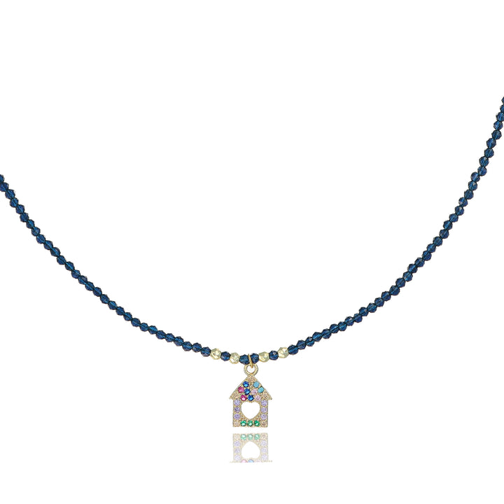 Collana con cristalli blu e casetta zirconata in acciaio dorato