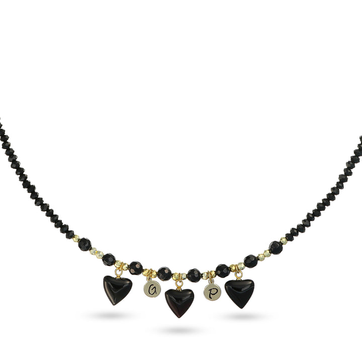 Collana con cuori in onice nero e iniziali in acciaio dorato