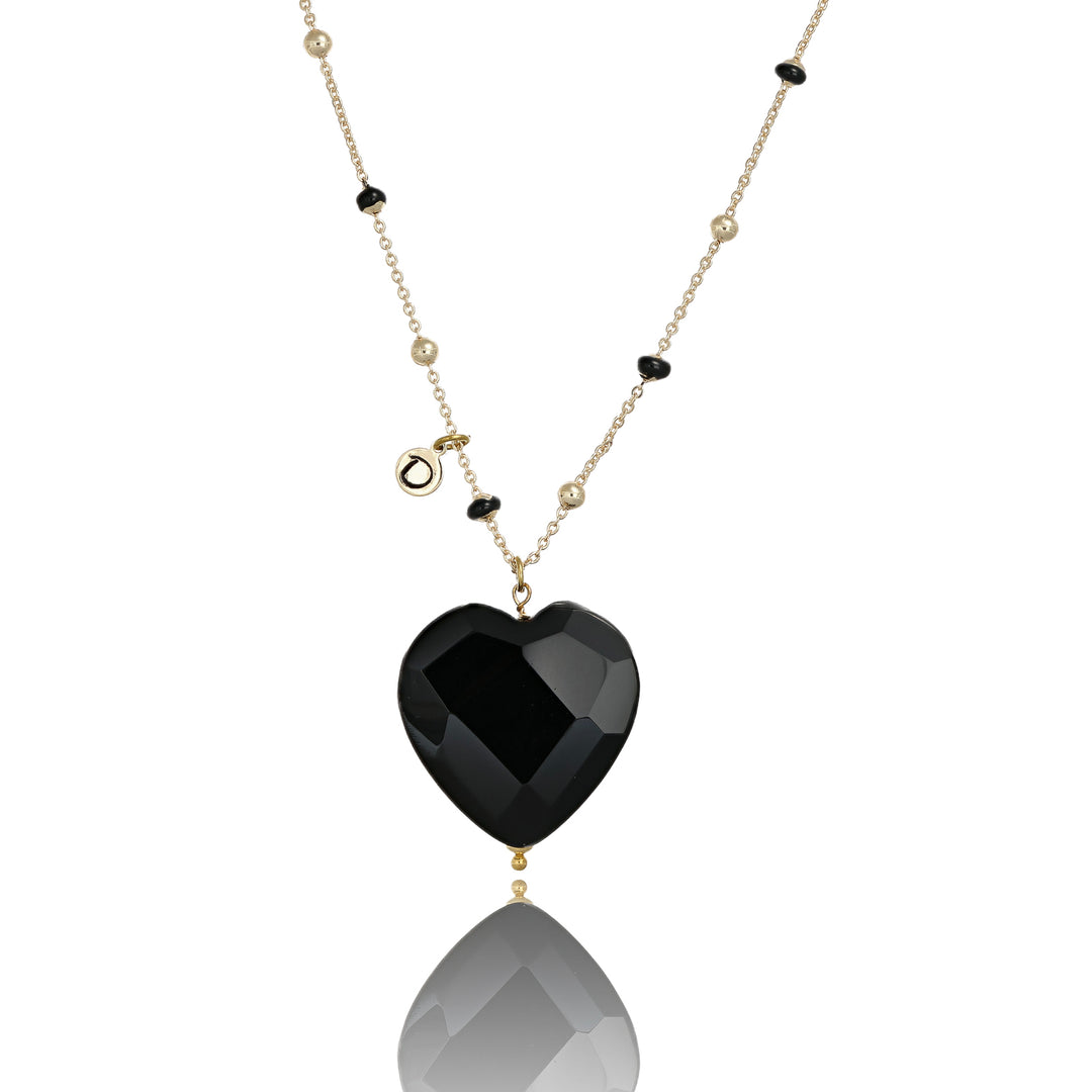 Collana con cuore in onice nero faccettato su catena con pallini neri in acciaio dorato