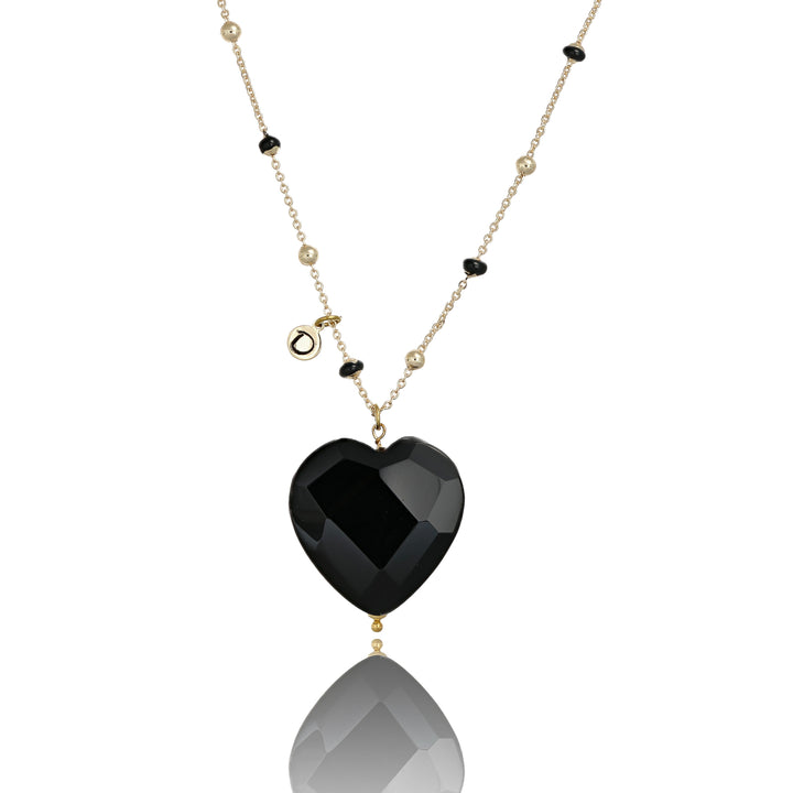 Collana con cuore in onice nero faccettato su catena con pallini neri in acciaio dorato