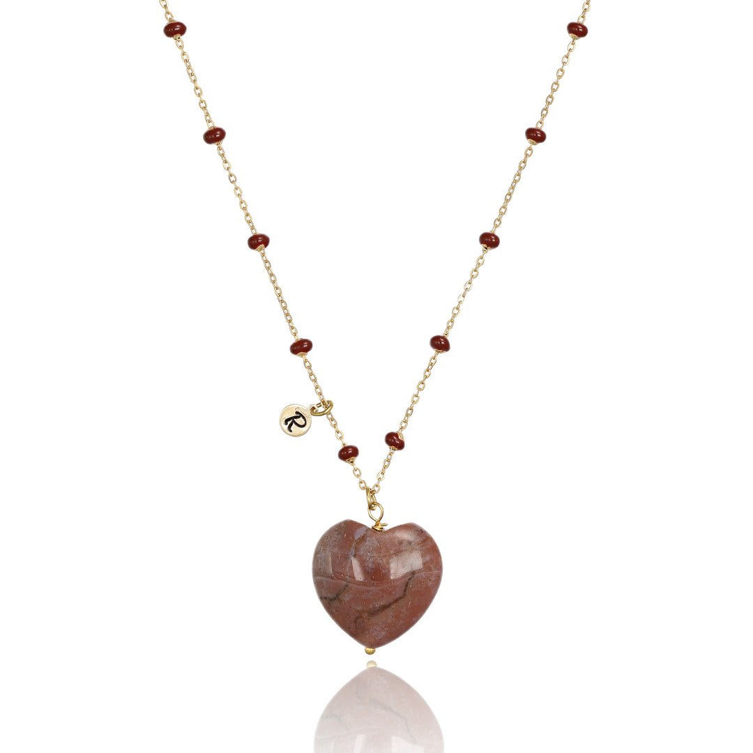 Collana con cuore bombato in agata vinaccia su catena con pallini bordò in acciaio dorato