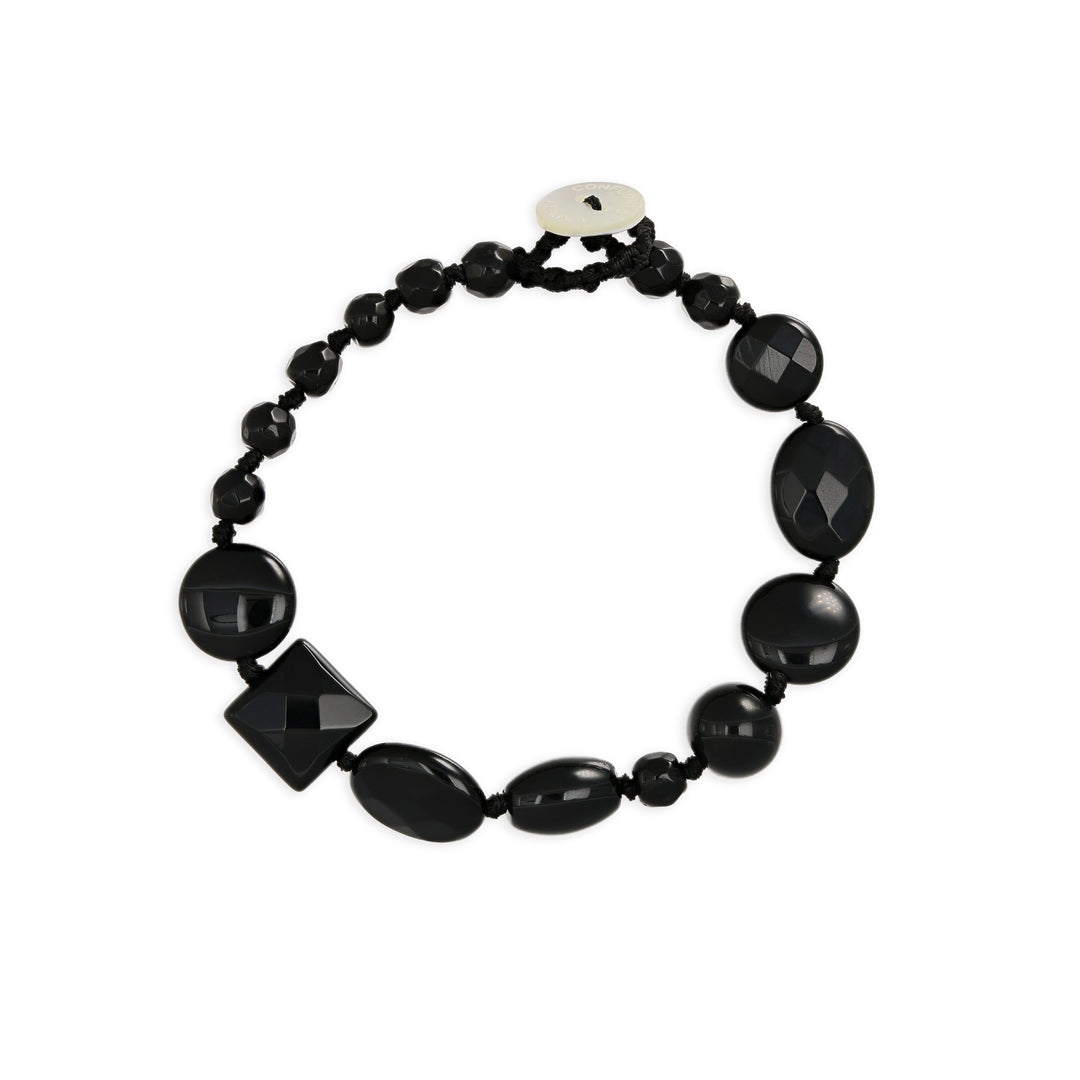 Bracciale nodini in onice nero con bottoncino in madreperla