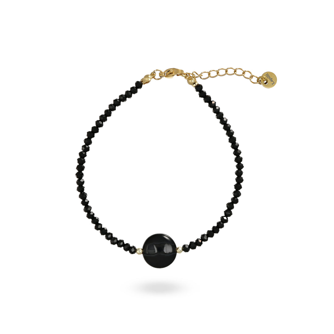 Bracciale con cristalli neri e centrale in onice nero su acciaio dorato.