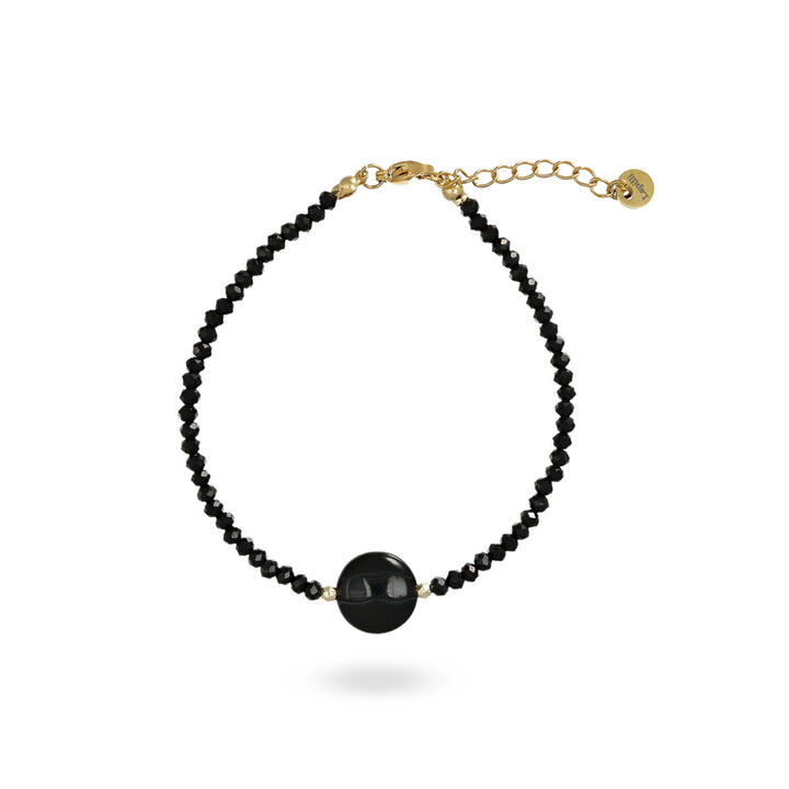 Bracciale con cristalli neri e centrale in onice nero su acciaio dorato.