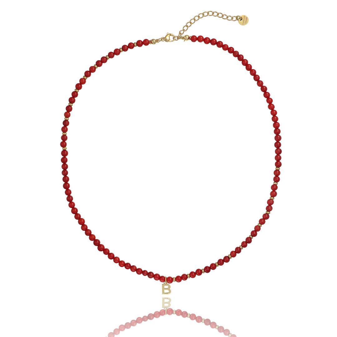 Collana in corallo bambù con iniziale in argento 925‰ dorato