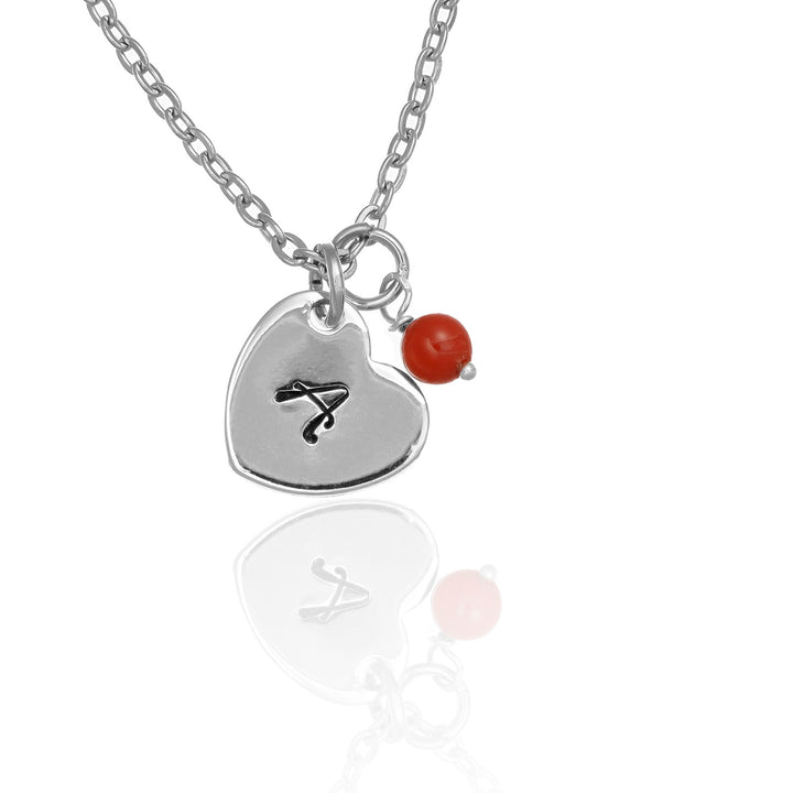 Collana con cuore inciso e corallo bambù in acciaio rodiato