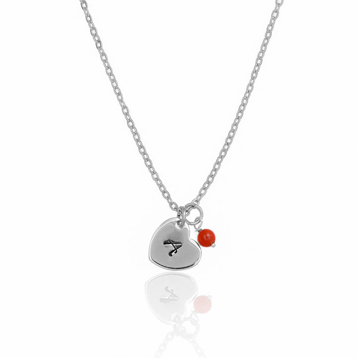 Collana con cuore inciso e corallo bambù in acciaio rodiato