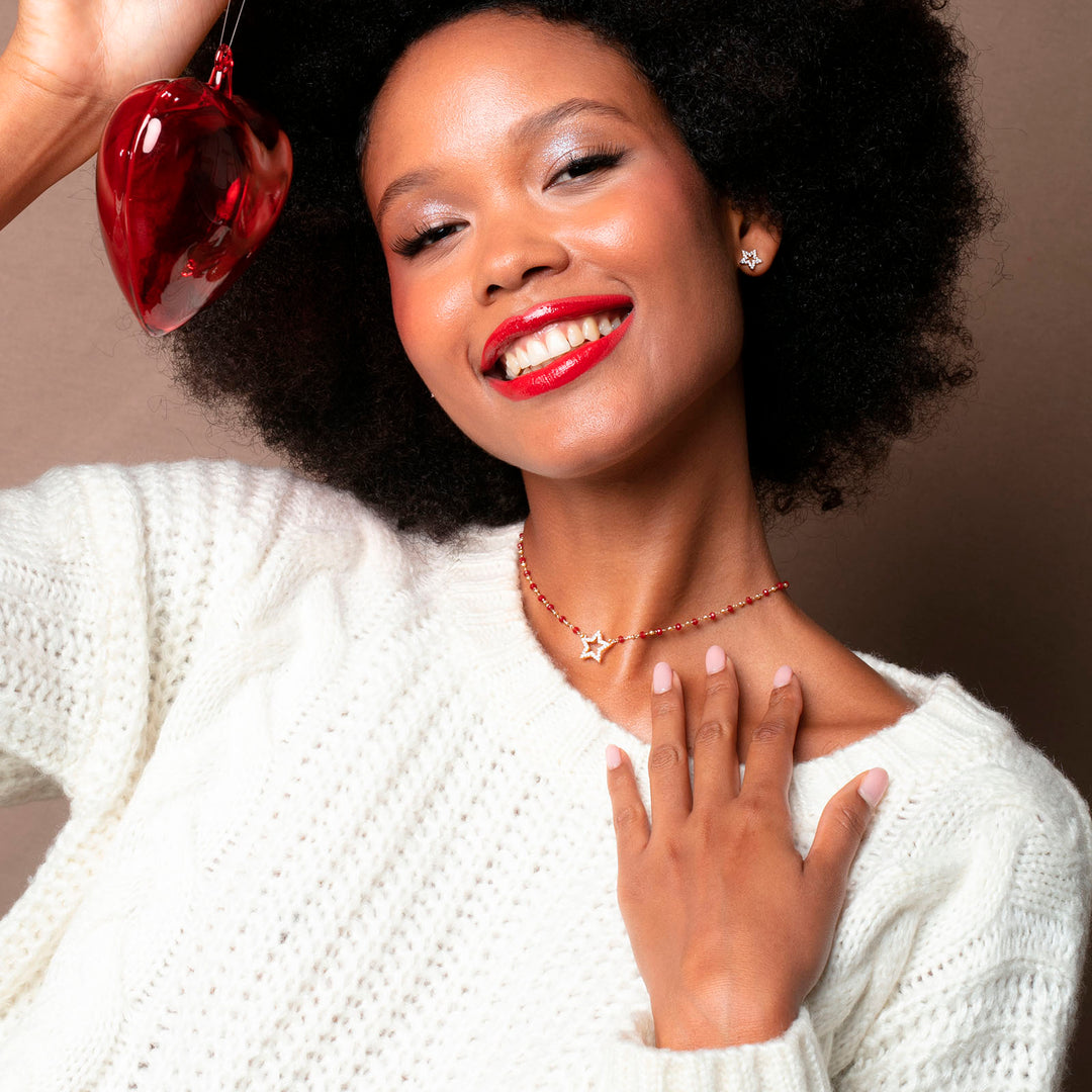 Collana stellina zirconata su catena cristalli bordò in acciaio dorato