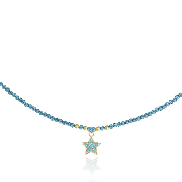 Collana con cristalli azzurro e stellina zirconata in acciaio dorato