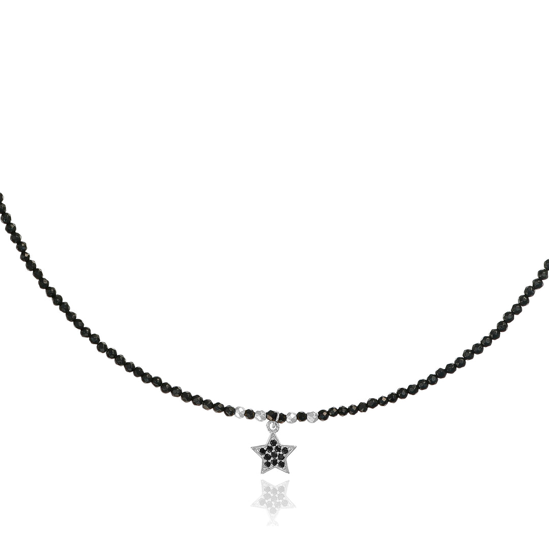 Collana con cristalli neri e stellina zirconata in acciaio